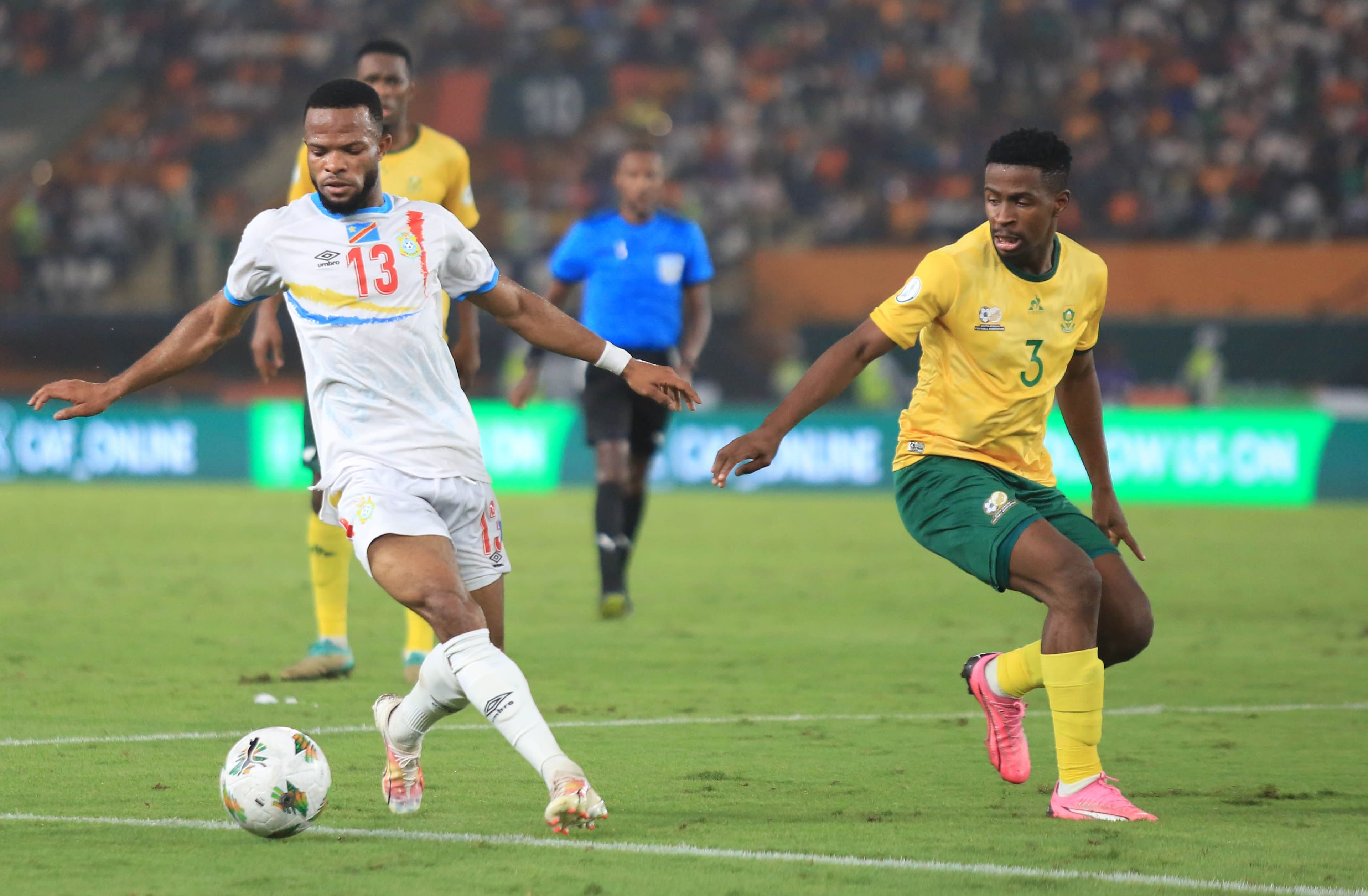 Terrence Mashego of South Africa (R) is fighting for the ball 