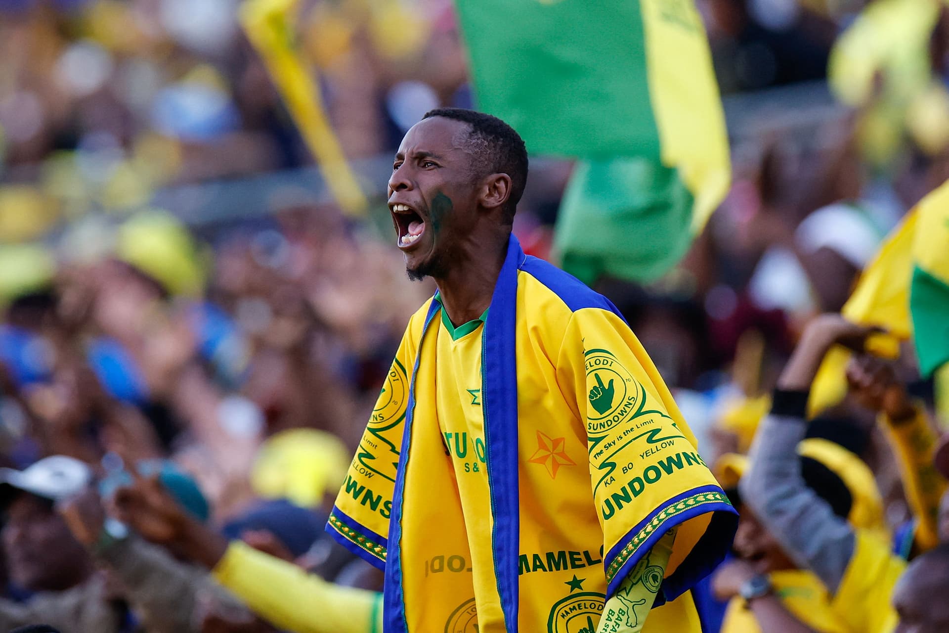 A Sundowns supporter celebrates his team's goal during the first leg of the CAF Champions League final / Getty Images