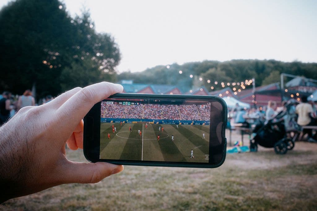 FRANCE-FAN-WATCHES-WORLD-CUP-2026-ON-PHONE